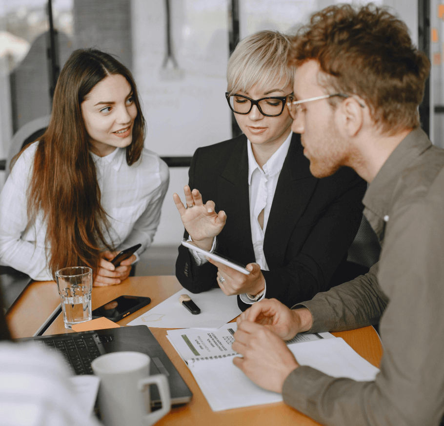 Team of professionals collaborating on financial strategies, showcasing expert guidance for corporate financial success in a modern office setting.